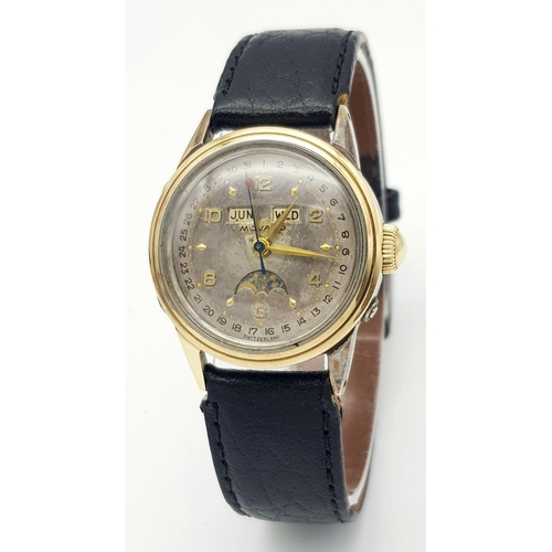 303 - A VINTAGE MOVADO GENTS WATCH IN GOLD AND STAINLESS STEEL WITH GREAT PATINA TO THE DIAL ,  MANUAL MOV... 