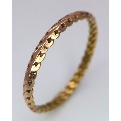 317 - An 18K Yellow Gold (tested) Decorative Thin Band Ring. Size N. 1g