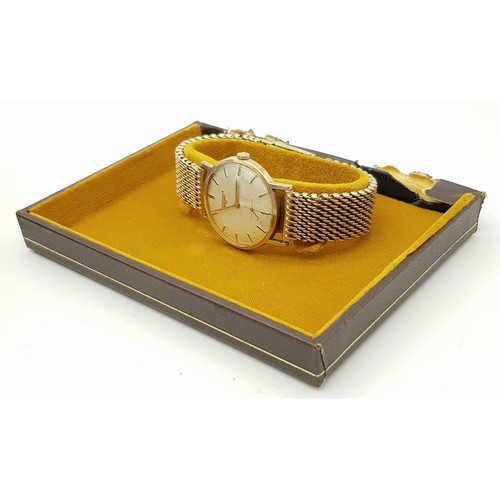 156 - A Vintage 9K Gold Longine Mechanical Watch. 9K Gold bracelet and case - 33mm. Patinaed cream dial wi... 