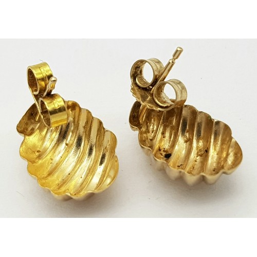 405 - A Pair of 9K Yellow Gold Shell Earrings. 15mm. 0.75g weight.