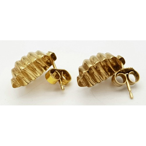 405 - A Pair of 9K Yellow Gold Shell Earrings. 15mm. 0.75g weight.