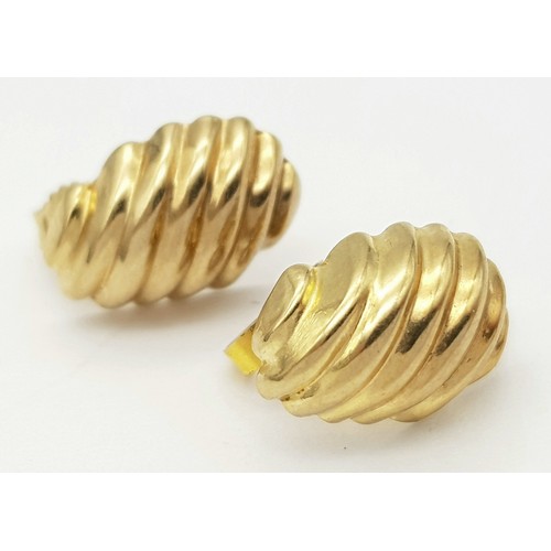 405 - A Pair of 9K Yellow Gold Shell Earrings. 15mm. 0.75g weight.