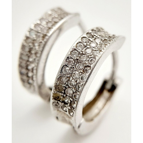 1509 - A stylish pair of 925 silver stone set hoop earrings. Total weight 3G.