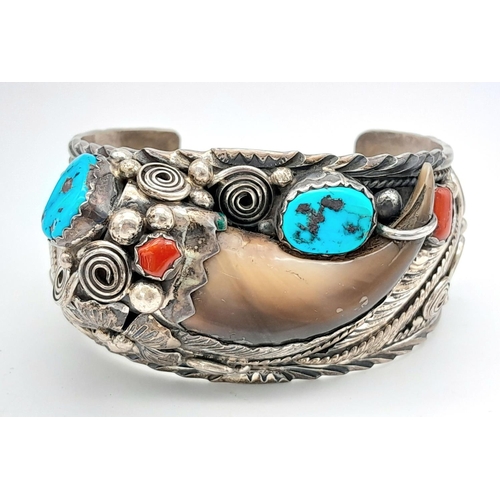 204 - A vintage designer ( Percy Spencer) sterling silver cuff bangle featuring Turquoise, blood coral and... 