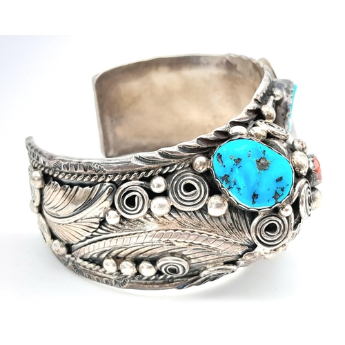 204 - A vintage designer ( Percy Spencer) sterling silver cuff bangle featuring Turquoise, blood coral and... 