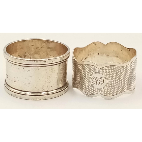 528 - Two Antique Hallmarked Silver Napkin Rings Comprising 1) An engine turned wave design Dated 1858/9 a... 