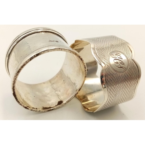 528 - Two Antique Hallmarked Silver Napkin Rings Comprising 1) An engine turned wave design Dated 1858/9 a... 