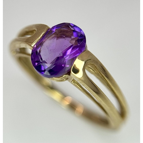 556 - A Tested Minimum 9 Carat Yellow Gold and Oval Cut Amethyst Solitaire Ring Size M. Set with an 8mm Ov... 