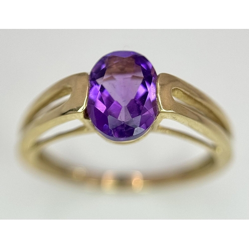 556 - A Tested Minimum 9 Carat Yellow Gold and Oval Cut Amethyst Solitaire Ring Size M. Set with an 8mm Ov... 