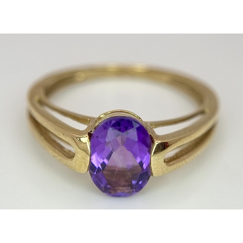 556 - A Tested Minimum 9 Carat Yellow Gold and Oval Cut Amethyst Solitaire Ring Size M. Set with an 8mm Ov... 