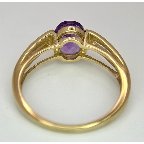 556 - A Tested Minimum 9 Carat Yellow Gold and Oval Cut Amethyst Solitaire Ring Size M. Set with an 8mm Ov... 