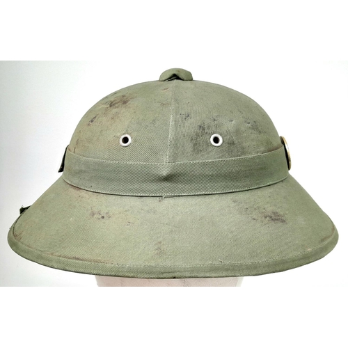 627 - WW2 Vietnam War Era North Vietnamese Army (NVA) Fiber Helmet with liner and cap and badge.