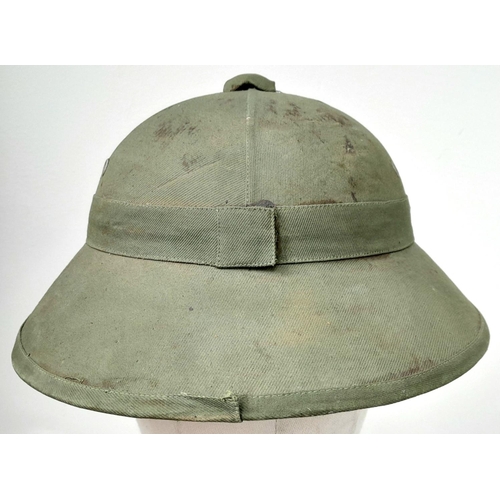 627 - WW2 Vietnam War Era North Vietnamese Army (NVA) Fiber Helmet with liner and cap and badge.