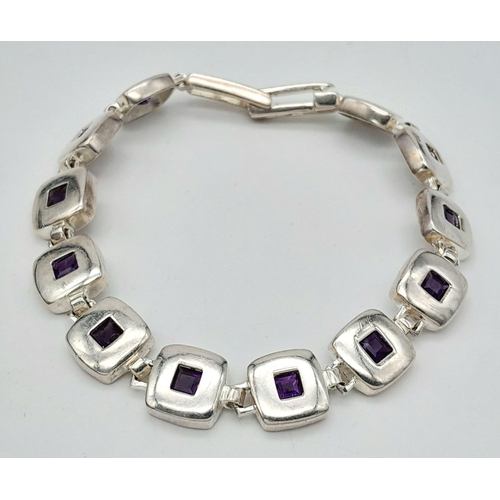 633 - A Vintage Sterling Silver Modernist Design Amethyst Set Tennis Bracelet 19.5cm Length. 18.07 Grams.