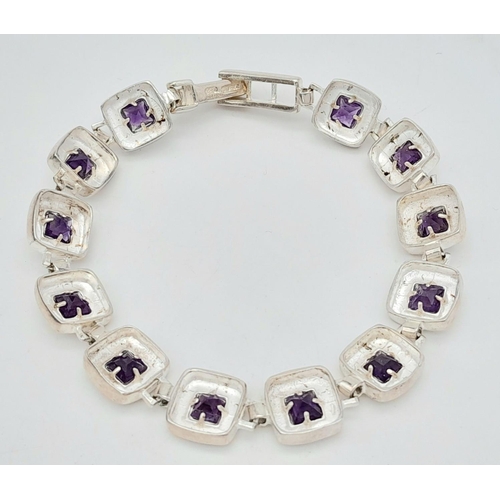 633 - A Vintage Sterling Silver Modernist Design Amethyst Set Tennis Bracelet 19.5cm Length. 18.07 Grams.