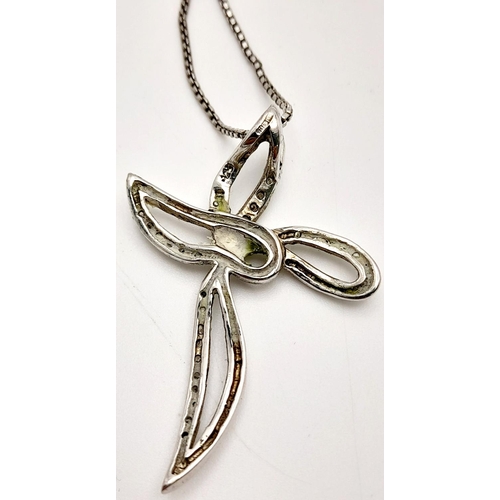 634 - A fancy 925 silver stone set cross pendant on silver box chain. Total weight 6.2G. Total length 43 c... 