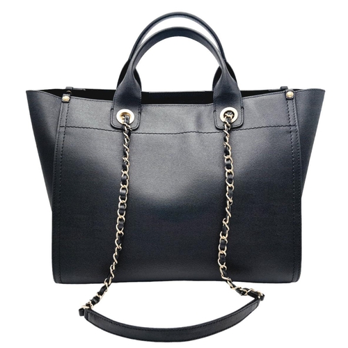 290 - A Chanel Deauville Tote Bag. Black leather exterior with gold tone hardware. Chanel, Paris silver to... 