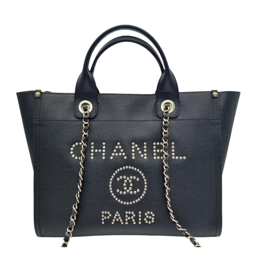 290 - A Chanel Deauville Tote Bag. Black leather exterior with gold tone hardware. Chanel, Paris silver to... 