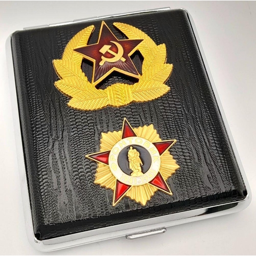 1500 - A Russian military cigarette case. Features 2 badges outside. Dimension: 8 X 10cm.