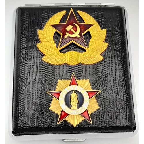 1500 - A Russian military cigarette case. Features 2 badges outside. Dimension: 8 X 10cm.