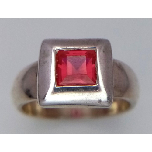 223 - Vintage SILVER and RUBY RING. Having a square cut Ruby in a SILVER FRAME mount. Complete with ring b... 