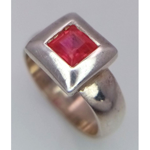 223 - Vintage SILVER and RUBY RING. Having a square cut Ruby in a SILVER FRAME mount. Complete with ring b... 