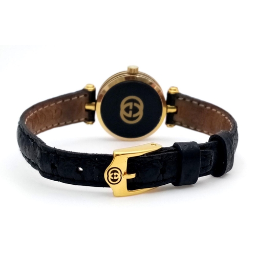 491 - A Designer Gucci Ladies Quartz Watch. Black leather strap with original Gucci clasp. Gold plated and... 