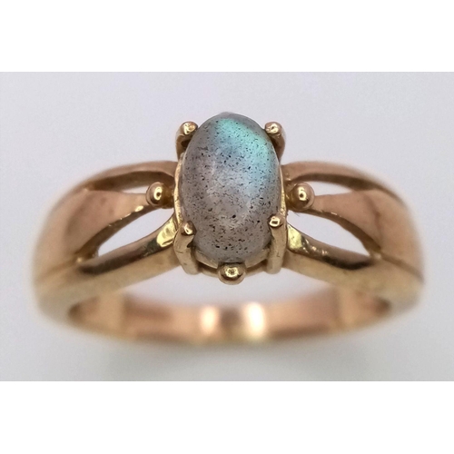 630 - Attractive 9 Carat GOLD RING with RAINBOW MOONSTONE CABOCHON to top.Full UK hallmark. 3.2 grams. Siz... 