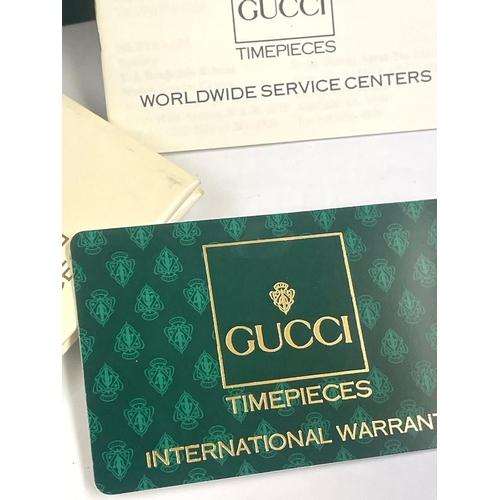 106 - A Gucci ladies bangle watch. Comes with box & papers, needs battery.