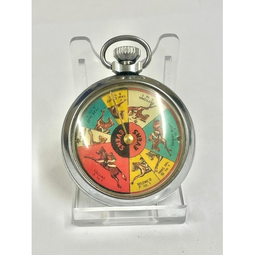 661 - A Vintage spinning horse racing gaming pocket watch. In working order.