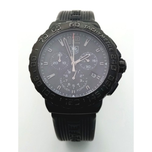 237 - A Tag Heuer Formula 1 Chronograph Gents Quartz Watch. Black Tag rubber strap. Black dial with three ... 