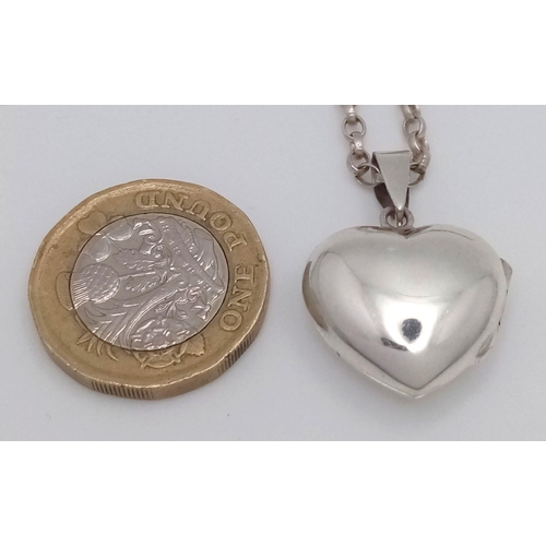 1503 - A 925 silver heart locket pendant on sterling silver belcher chain. Total weight 9.1G. Total length ... 