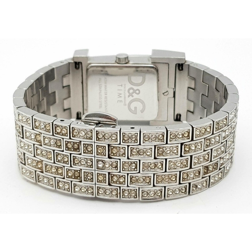 203 - An absolutely stanning, DOLCE & GABBANA TIME ladies bracelet watch, totally covered with “diamanté”,... 