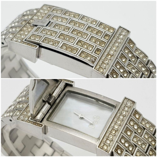 203 - An absolutely stanning, DOLCE & GABBANA TIME ladies bracelet watch, totally covered with “diamanté”,... 