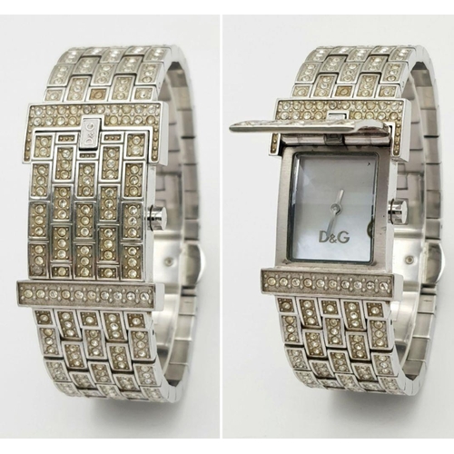 203 - An absolutely stanning, DOLCE & GABBANA TIME ladies bracelet watch, totally covered with “diamanté”,... 