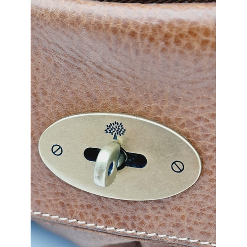 309 - A Mulberry Bayswater Brown Leather Bag. Textured brown leather exterior with lock and zipped compart... 