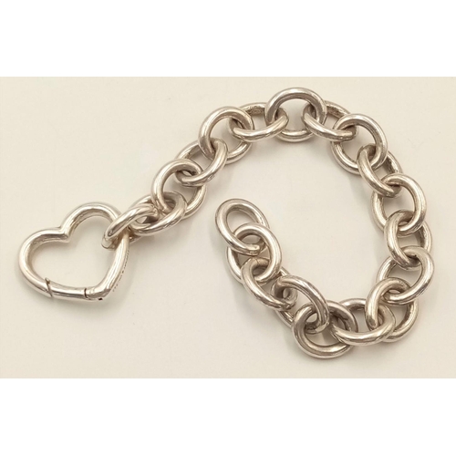 393 - A Very Collectible Tiffany Sterling Silver 'Open Heart' Bracelet. Oval links with a large heart clas... 