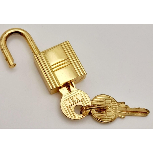 408 - A Gold Tone Hermes Branded Small Padlock with Two Keys.