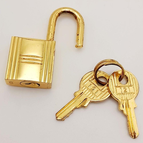 408 - A Gold Tone Hermes Branded Small Padlock with Two Keys.