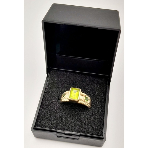 56 - Stunning 9 carat GOLD and PERIDOT RING. Consisting  Emerald cut PERIDOT gemstone mounted to top. Hav... 