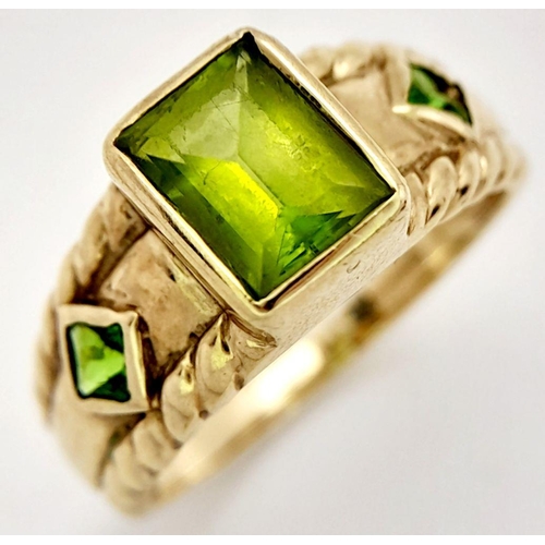 56 - Stunning 9 carat GOLD and PERIDOT RING. Consisting  Emerald cut PERIDOT gemstone mounted to top. Hav... 