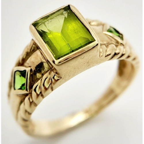 56 - Stunning 9 carat GOLD and PERIDOT RING. Consisting  Emerald cut PERIDOT gemstone mounted to top. Hav... 