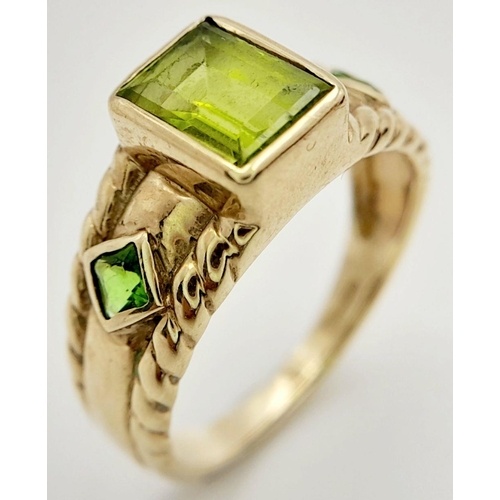 56 - Stunning 9 carat GOLD and PERIDOT RING. Consisting  Emerald cut PERIDOT gemstone mounted to top. Hav... 