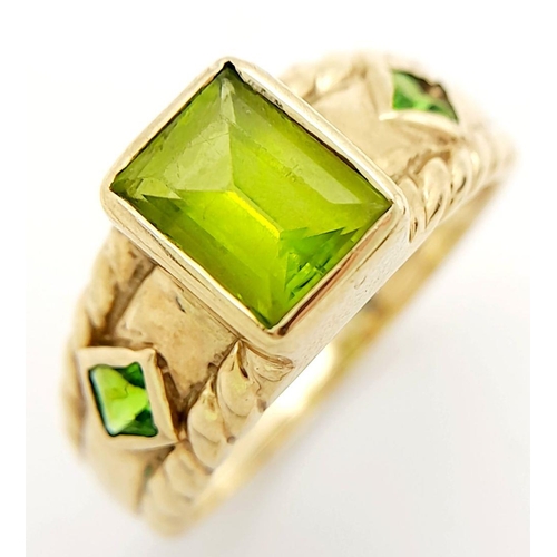 56 - Stunning 9 carat GOLD and PERIDOT RING. Consisting  Emerald cut PERIDOT gemstone mounted to top. Hav... 