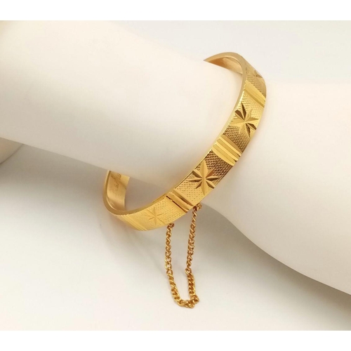 637 - Impressive Vintage 18 carat Rolled Gold plated BANGLE. Complete with safety chain. Diamond cut chase... 