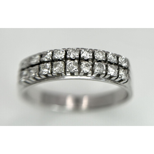 596 - An 18K White Gold and Two Row Diamond Ring. 18 brilliant round cut diamonds - 0.90ctw. Size Q. 4.4g ... 