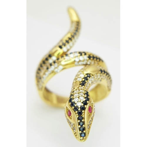 508 - A Tempting 18K Yellow Gold, Sapphire and Diamond Serpent Ring. This ruby eyed reptile will coil arou... 