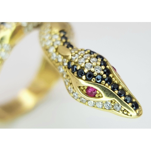 508 - A Tempting 18K Yellow Gold, Sapphire and Diamond Serpent Ring. This ruby eyed reptile will coil arou... 