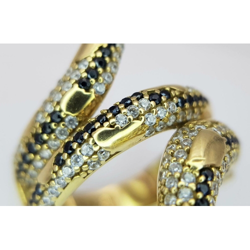 508 - A Tempting 18K Yellow Gold, Sapphire and Diamond Serpent Ring. This ruby eyed reptile will coil arou... 