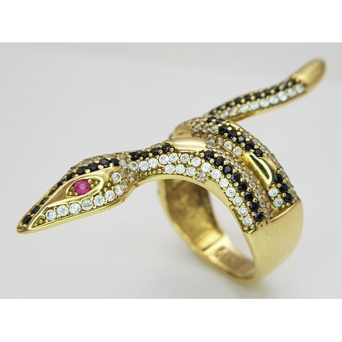 508 - A Tempting 18K Yellow Gold, Sapphire and Diamond Serpent Ring. This ruby eyed reptile will coil arou... 